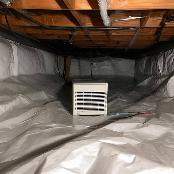 An encapsulated crawlspace with a dehumidifier in the center