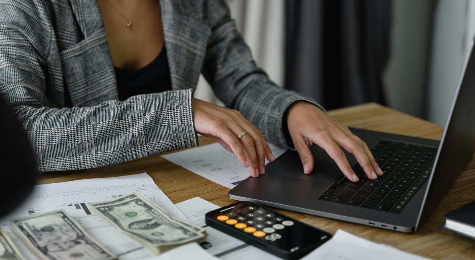 Woman in a blazer lookin at information costs