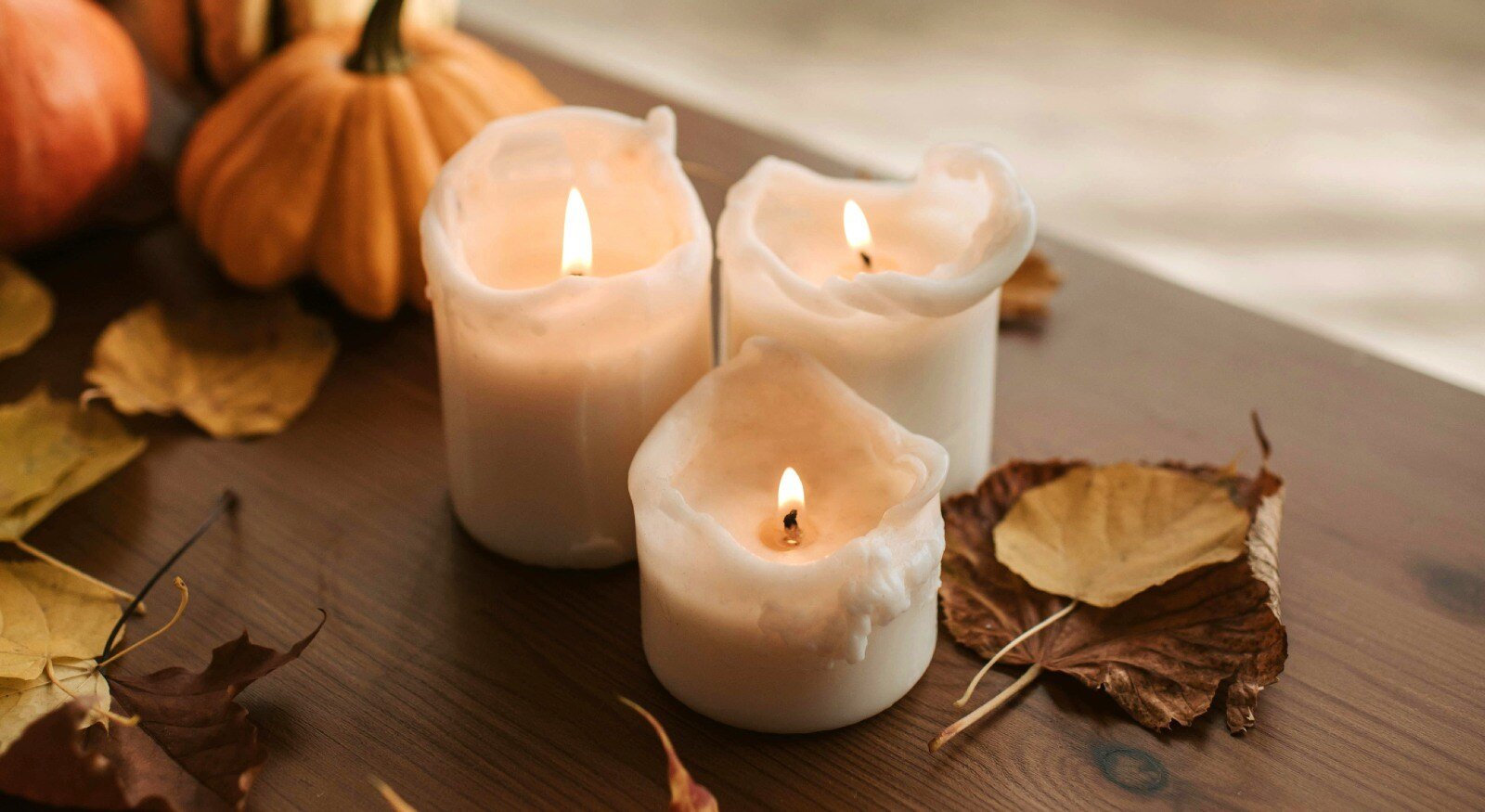 Candles and pumpkin as decorations for house in fall