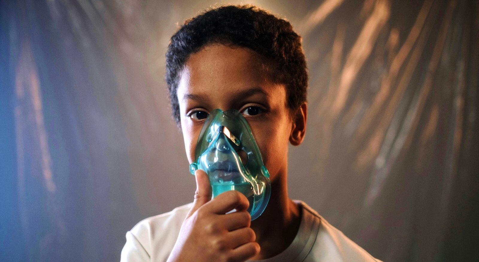 A child using an inhaler for asthma.