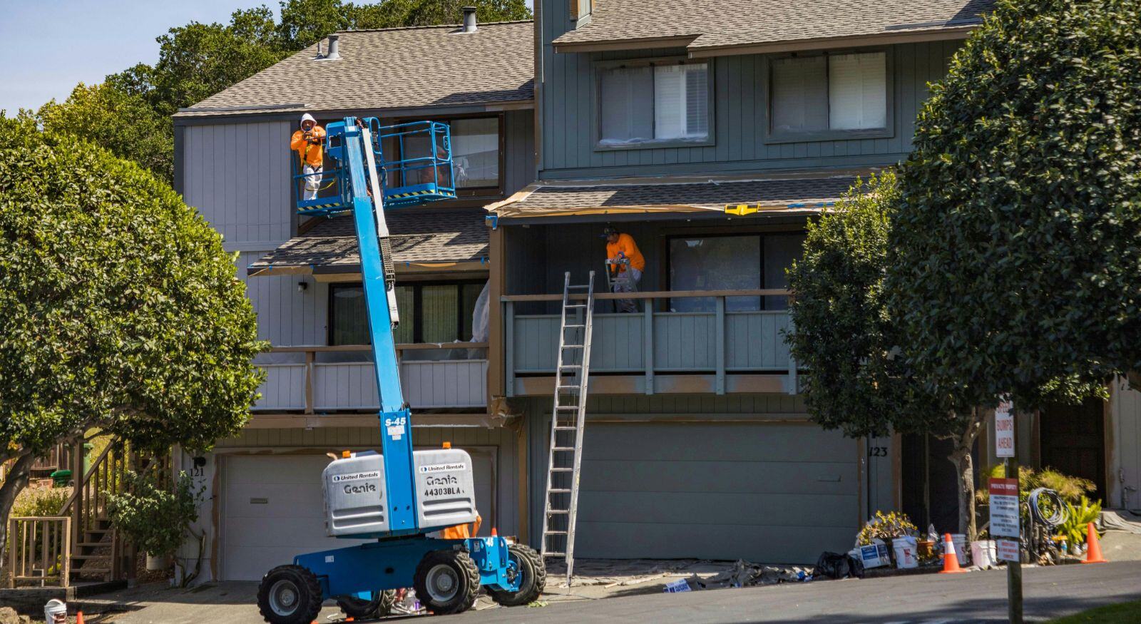 Technicians working in repairing a house with structural damage